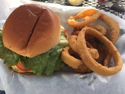 Hot & spicy burger with cold onion rings.