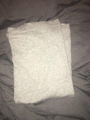 t-shirt folded like a block. The sleeves should be on outside, not inside