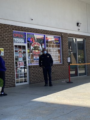 Police officer making sure the place doesn't get too crowded.