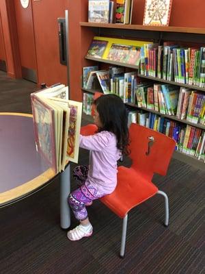 One of the kids at Learn and Grow enjoying free reading time at the Cupertino Library