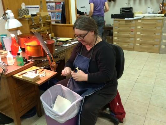 Jane carving a cello bridge.