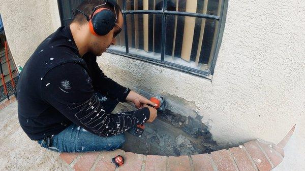 Removing and repairing stucco patch for big cracks and leaks.