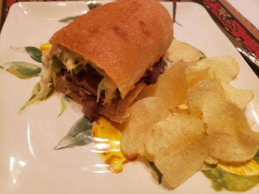 Cheesesteak sub on a plate from the B&B we were staying at.