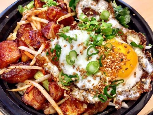 Crispy Pork Belly w/Bean Sprout mix,Miso Citrus salad,topped w/ a sunny side up egg all over Jasmine rice w/Sriracha lime sauce!