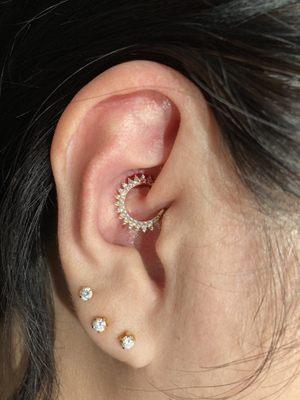 Daith piercing done with our very own exclusive line of gold jewlery!