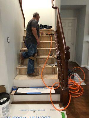 Hardwood floor combine with white face per step.