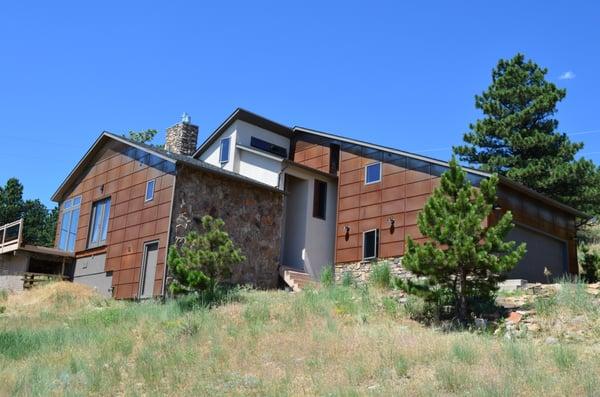 This beautiful Boulder home has CorTen Steel custom panels. Makes the siding of the home have a rustic look to it.