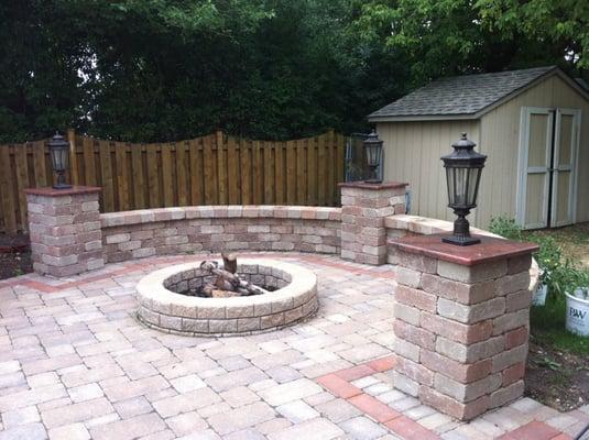 Fire Pit with Elegant Light Fixtures & Granite Coping