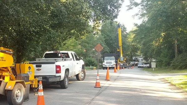 a 100 ft boom and reached my house from the street. He had obtained all the permit from the city