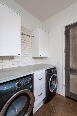 Custom Built home - Laundry room with countertop space and hanging