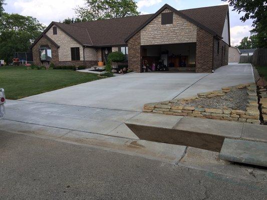 Driveway ,front porch,side drive and concrete patio and drive to barn in back