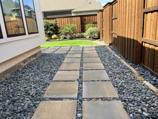 Beautiful walking path with pavers discolored and Mexican pebbles