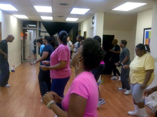 Zumba patrons enjoying a good workout from fitness guru Riley.