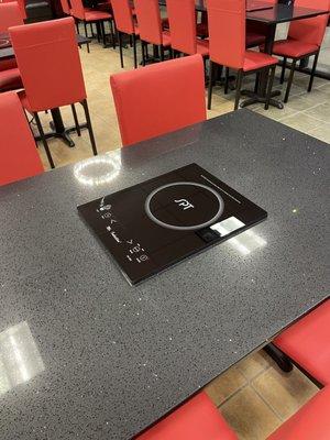 Induction plates at each table