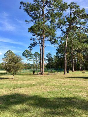 Picnic tables & grill in the far back, southwest corner of the park.