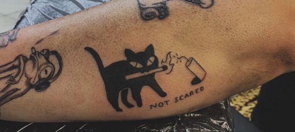 Black cat tattoo