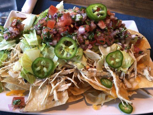 Nachos with sour cream on the side.