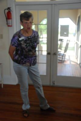 Docent Soni at the door to the porch