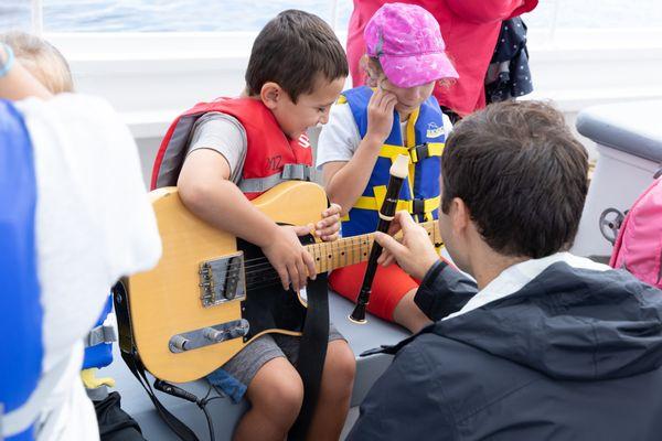 Guitar lesson on board the Schooner Adventure!