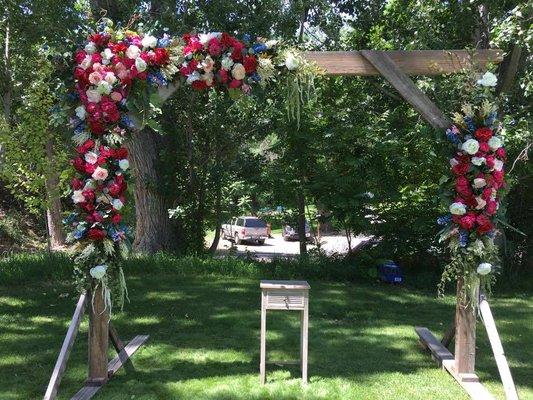 A stunning 10 foot tall rustic wedding arch we designed and built.