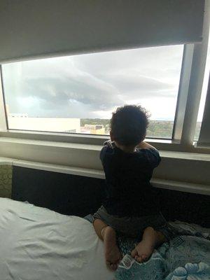 My son watching hurricane Ian during our long stay