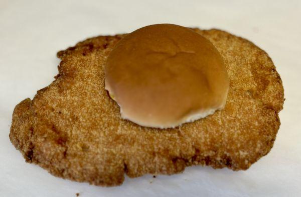 Hand breaded Jumbo 1/2 pound pork tenderloin.