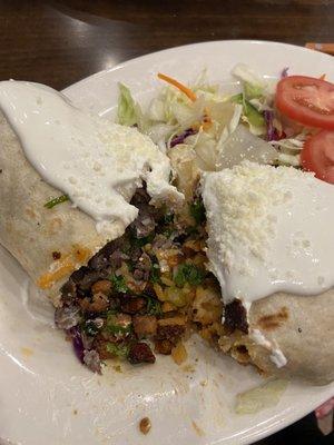 Carne Asada Burrito on the left half and chicken burrito on the right half.