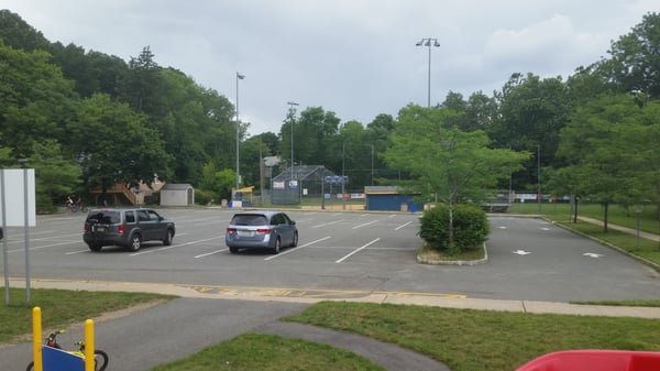 Small Private Parking Lot being used as a place to ride bikes