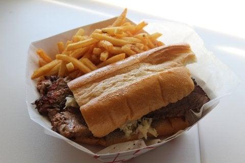 Smoked brisket with Slaw and Brie on Cuban Bread with Truffle Fries