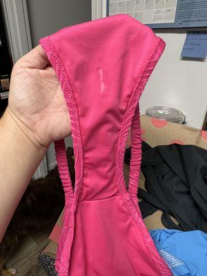 Residue on a used bathing suit bottom being sold as brand new