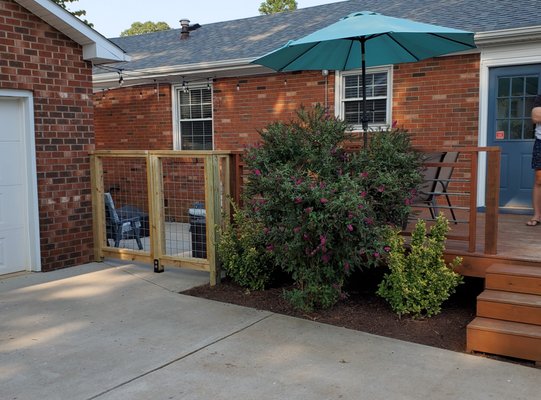 Custom fence solution to minimize visual obstruction to the customer's backyard while fully fencing in the yard for their dog.