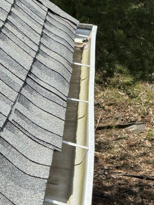 Improperly installed drip edges causing warped shingles 4 years later