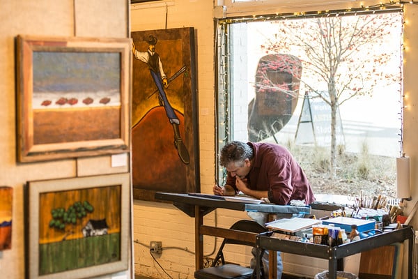 Philip DeAngelo hard at work on a painting.