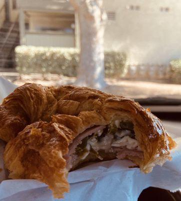 Ham and cheese croissant with jalapeño