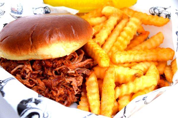 Tender pulled pork on a buttery grilled brioche bun