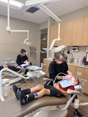 Two dentist chairs in the same room are great for keeping siblings together.