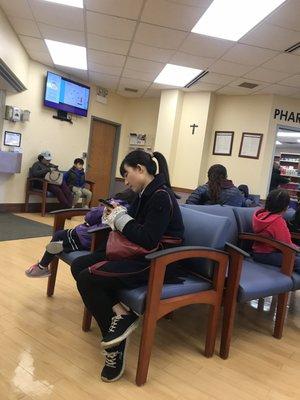 Another shot of waiting room with patient tv playing