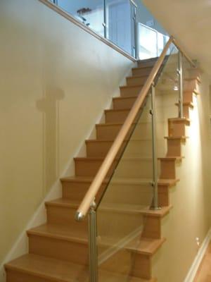 We supply and install wood stairs and stainless steel/glass railings