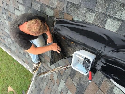 Drain from flat roof is draining onto shingle roof and faulty detail work has caused serious water infiltration during recent...