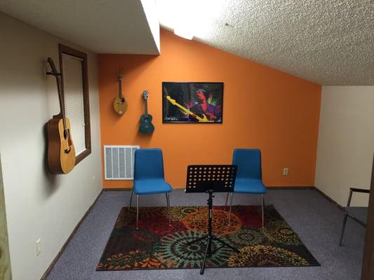 Fun, quiet lesson studio. A glass door protects the student from distractions but allows parents to hear their progress in the next room.