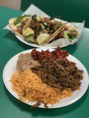 Fajita and al pastor meats with rice and beans