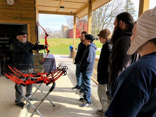 Our group learning the finer points of holding the bow.