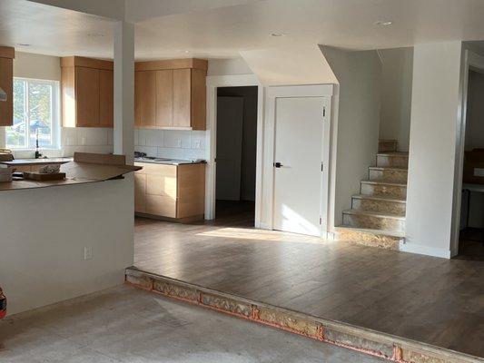 Sunken floor front room, kitchen and staircase