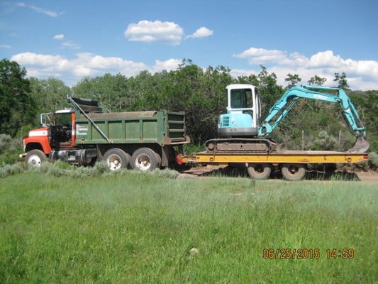 Dump truck and mini excavator