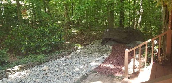 More of the beautiful rock river stream wrapping around the side of our home in Farren Forest.