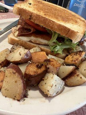 Club sandwich with home fries