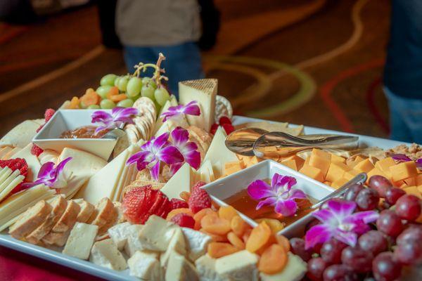 The cheese plate helping to give more of a sense of space at the "Maxxie LaWow: Drag Super-shero" Preview Party 3/30 in San Jose