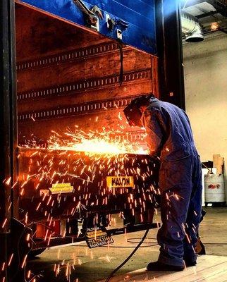 Our technician, Tony, installing a lift gate on an Isuzu NQR.