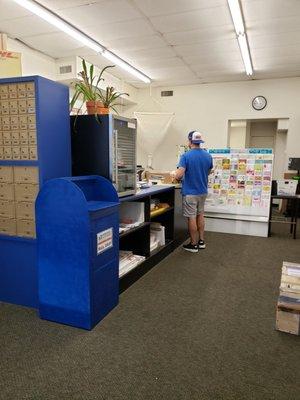 Front counter with PO boxes and card display.