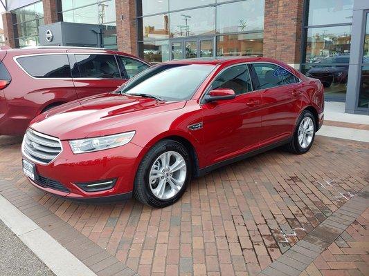 At Dutro on 12/8/18    2018 Ford Taurus SEL AWD Ruby Red Metallic.  They had her parked right in front waiting for me.   $9500 discount!